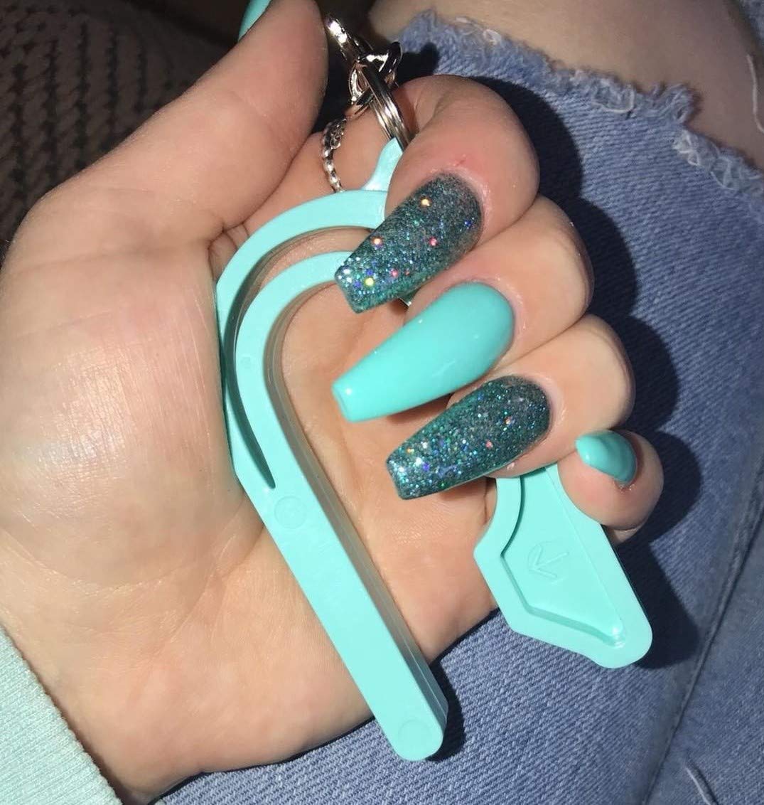 The Car Seat Key - Original Car Seat Key Chain Buckle Release Tool - Easy Unbuckle Opener Aid for Nails, Parents, Grandparents & Older Children by NAMRA Made in USA (Black)